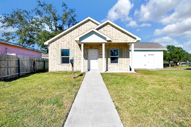 view of front of property with covered porch and a front lawn