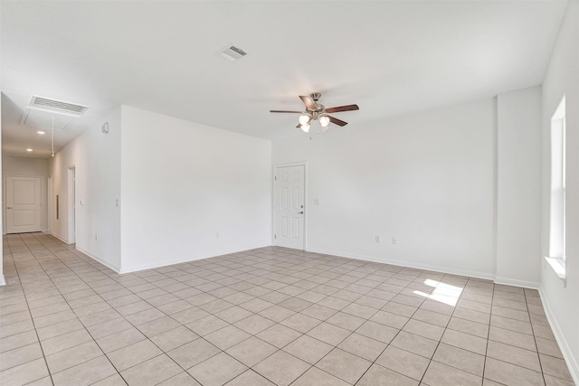 unfurnished room featuring ceiling fan and light tile patterned floors