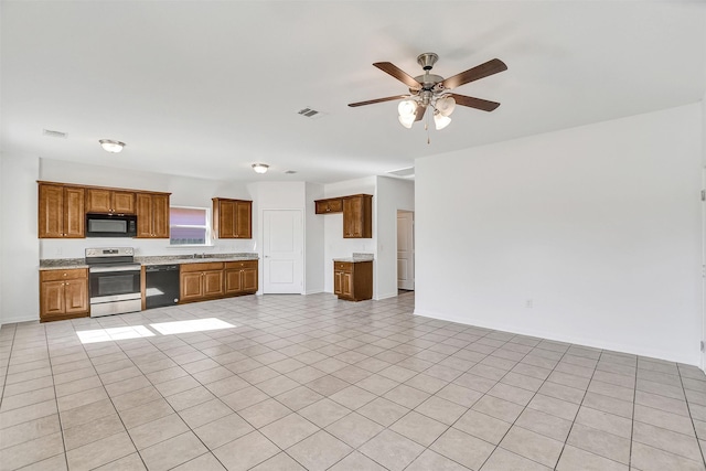 kitchen featuring ceiling fan, sink, light tile patterned floors, and black appliances