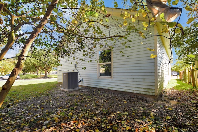 view of side of home featuring central AC