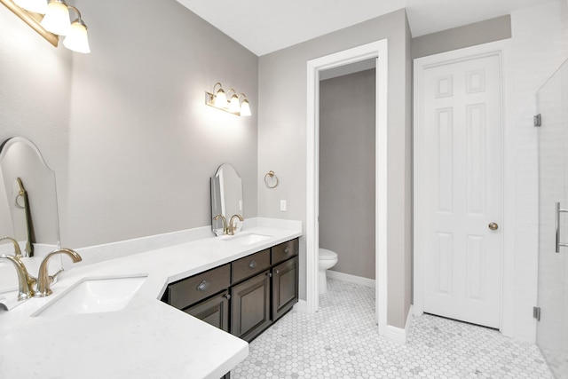 bathroom featuring tile patterned flooring, vanity, and toilet