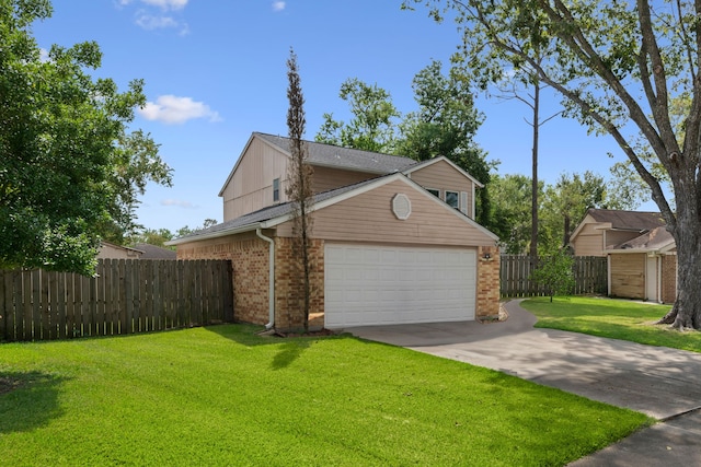 view of front of home with a front yard and a garage