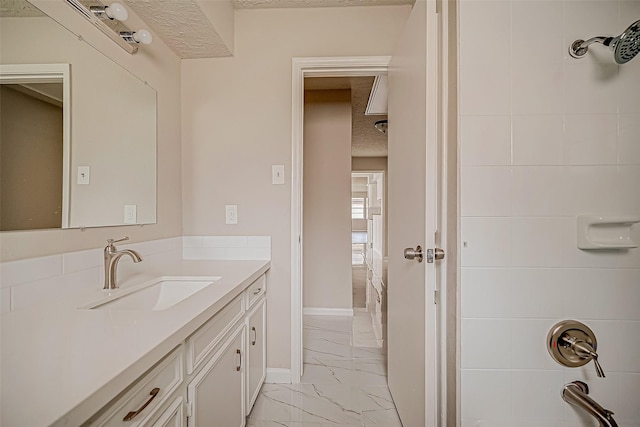 bathroom featuring vanity and a textured ceiling