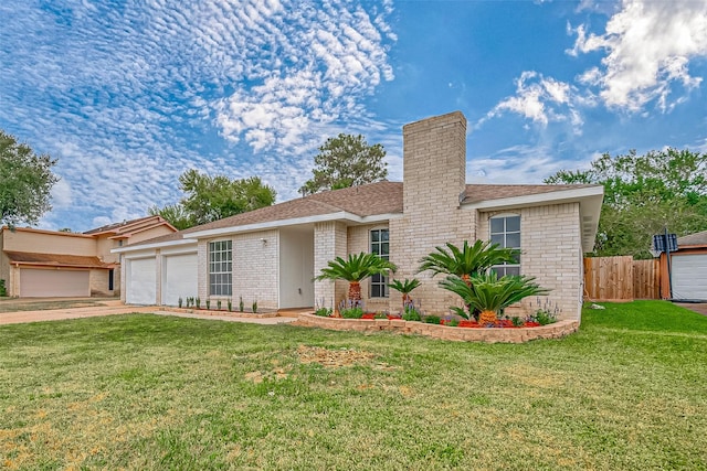 ranch-style home with a front yard and a garage