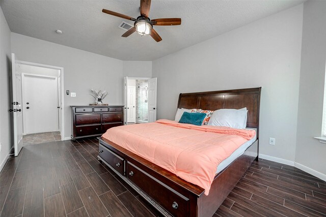 bedroom featuring a textured ceiling, ceiling fan, and dark wood-type flooring