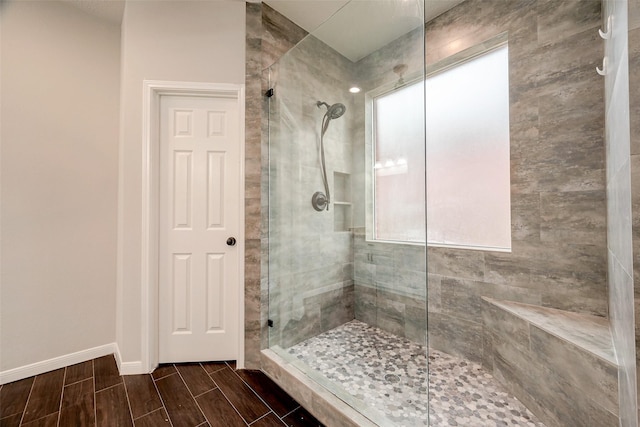 bathroom with a tile shower