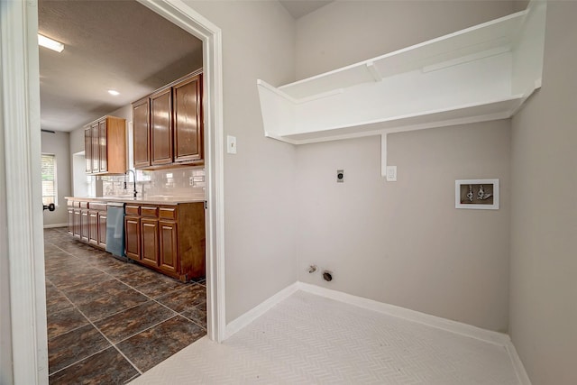 laundry room with electric dryer hookup, sink, and washer hookup