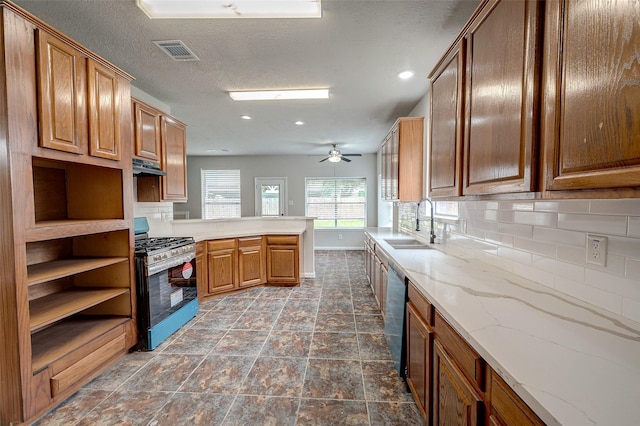 kitchen with decorative backsplash, ceiling fan, sink, dishwasher, and range with gas stovetop