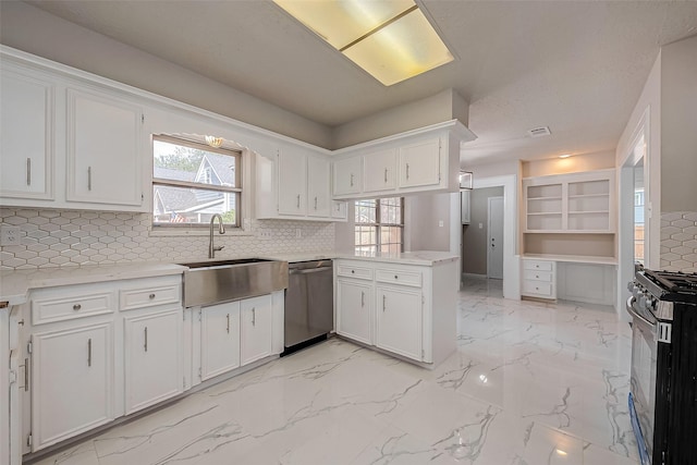 kitchen featuring white cabinetry, sink, stainless steel dishwasher, and black gas range oven