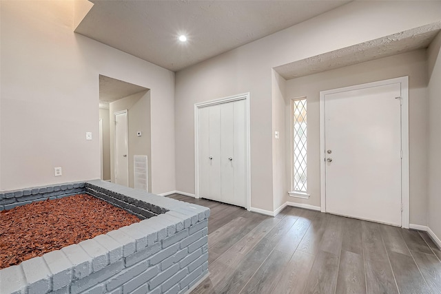 entrance foyer featuring hardwood / wood-style flooring