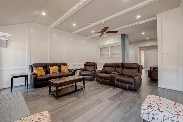 living room featuring ceiling fan, wood-type flooring, and built in shelves