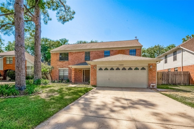 view of front of house with a front lawn and a garage