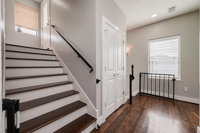 staircase featuring wood-type flooring