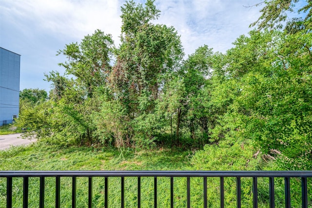 view of yard with a balcony