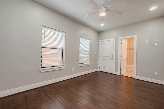 empty room featuring dark wood-style floors, ceiling fan, baseboards, and recessed lighting