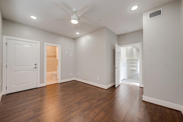 empty room featuring baseboards, visible vents, wood finished floors, and recessed lighting