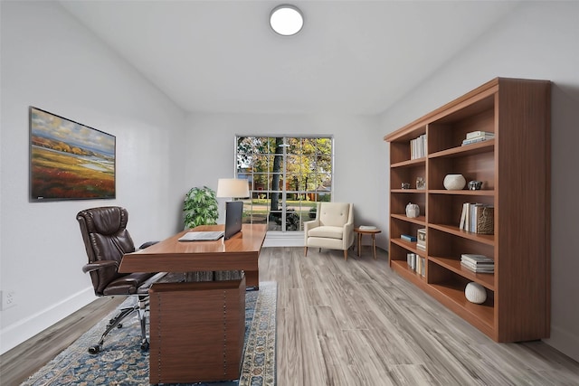 office with hardwood / wood-style flooring