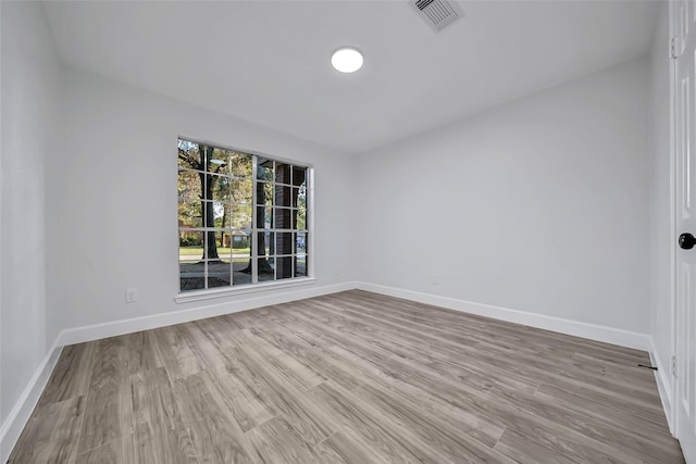 unfurnished room featuring light hardwood / wood-style floors