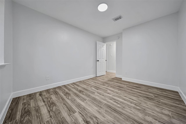 spare room featuring light wood-type flooring