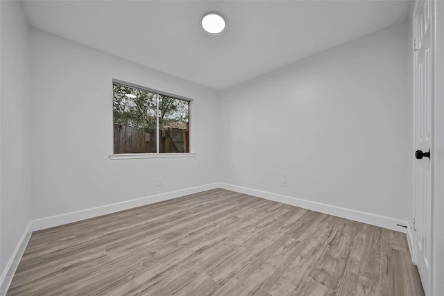 spare room featuring light hardwood / wood-style flooring