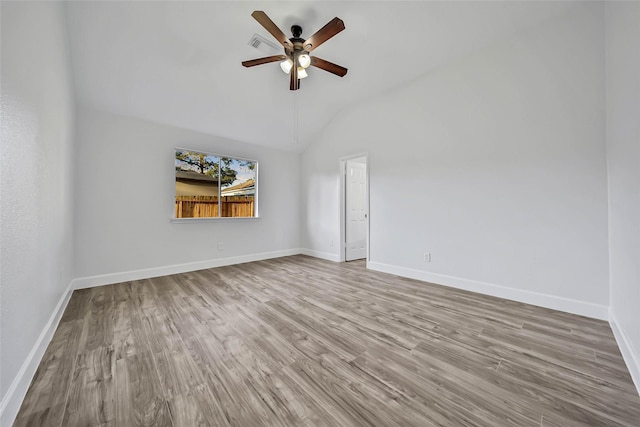 spare room with ceiling fan, light hardwood / wood-style floors, and lofted ceiling