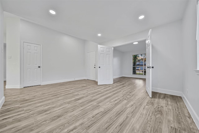 spare room featuring light wood-type flooring