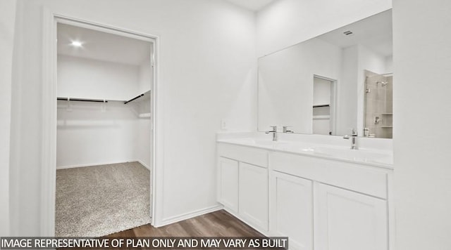 bathroom featuring a shower, vanity, and hardwood / wood-style flooring