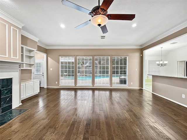 unfurnished living room with dark hardwood / wood-style floors, ornamental molding, and a fireplace