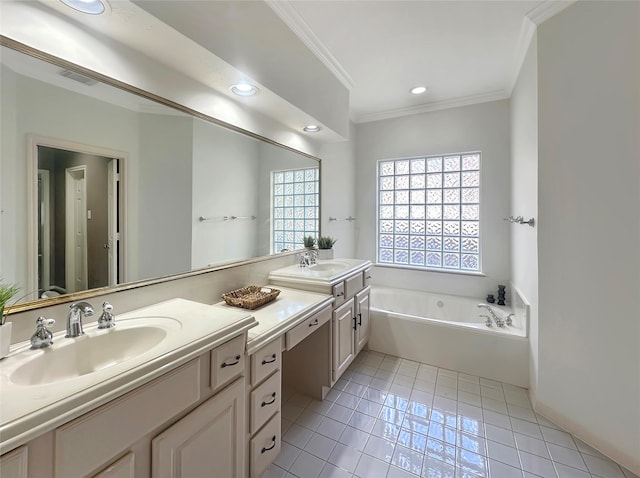 bathroom featuring tile patterned floors, vanity, a bath, and crown molding