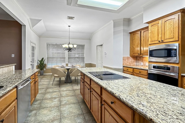 kitchen featuring appliances with stainless steel finishes, ornamental molding, pendant lighting, an inviting chandelier, and lofted ceiling