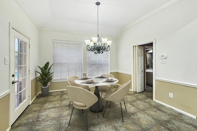 dining space featuring an inviting chandelier, crown molding, and a healthy amount of sunlight