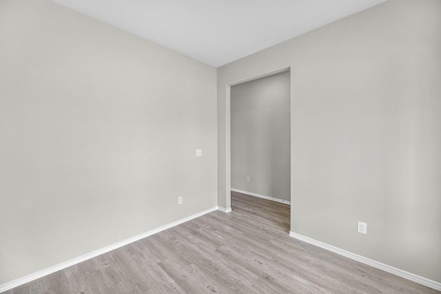 spare room with light wood-type flooring