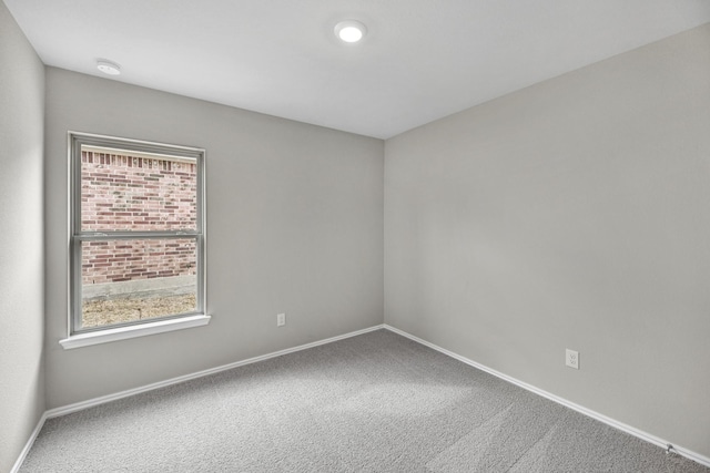 carpeted empty room with plenty of natural light