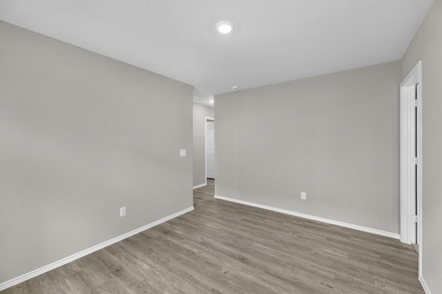 spare room featuring hardwood / wood-style flooring