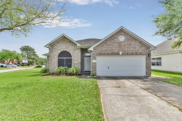 view of front of home featuring a garage and a front lawn