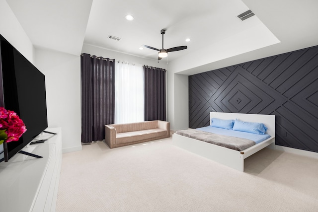 bedroom featuring light colored carpet and ceiling fan