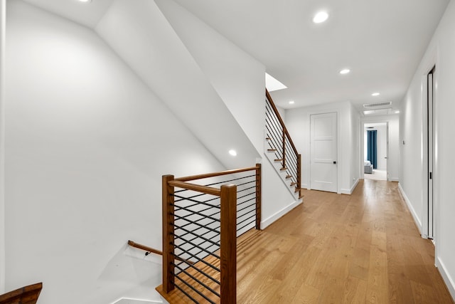 hall with light hardwood / wood-style flooring