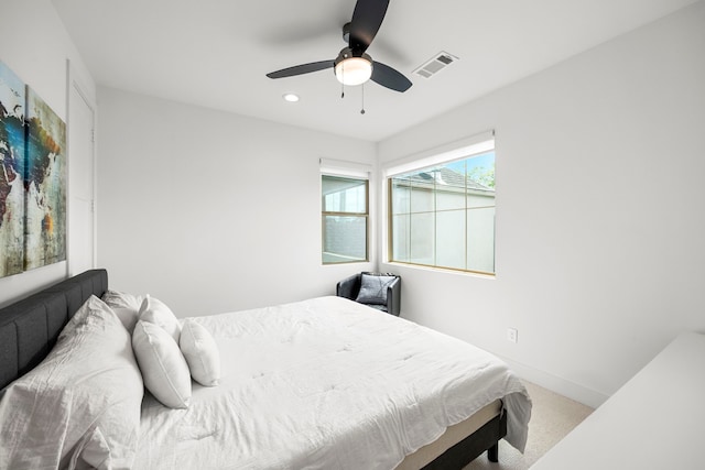 carpeted bedroom featuring ceiling fan