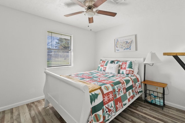 bedroom featuring ceiling fan and dark hardwood / wood-style floors