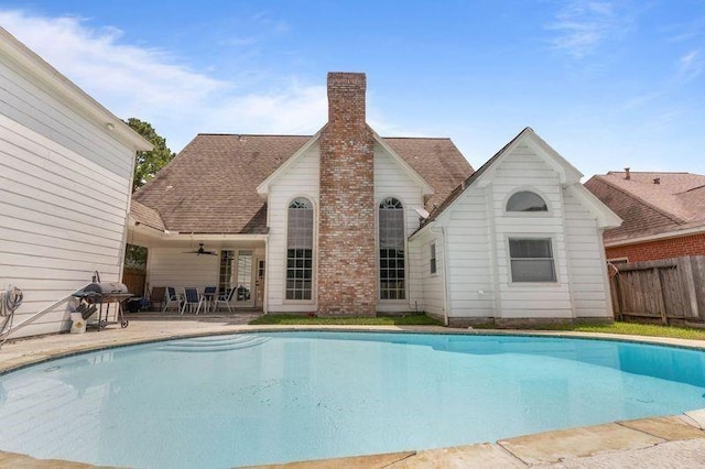 view of pool with ceiling fan, a patio, and grilling area