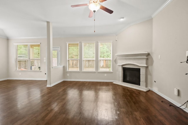 unfurnished living room with dark hardwood / wood-style flooring, plenty of natural light, and ornamental molding