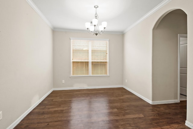 unfurnished room featuring ornamental molding, dark hardwood / wood-style floors, and an inviting chandelier