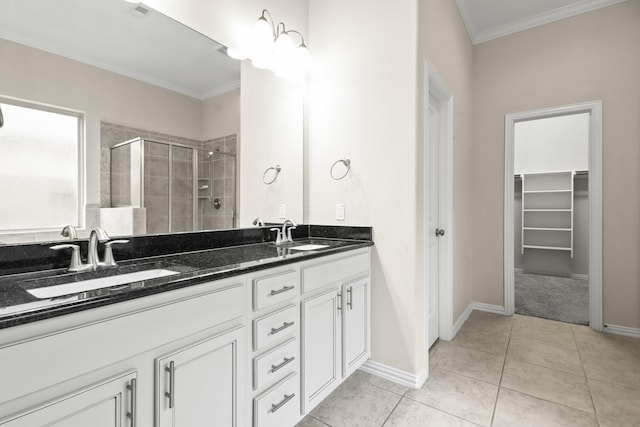 bathroom featuring tile patterned flooring, vanity, an enclosed shower, and ornamental molding