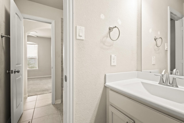 bathroom featuring tile patterned flooring and vanity