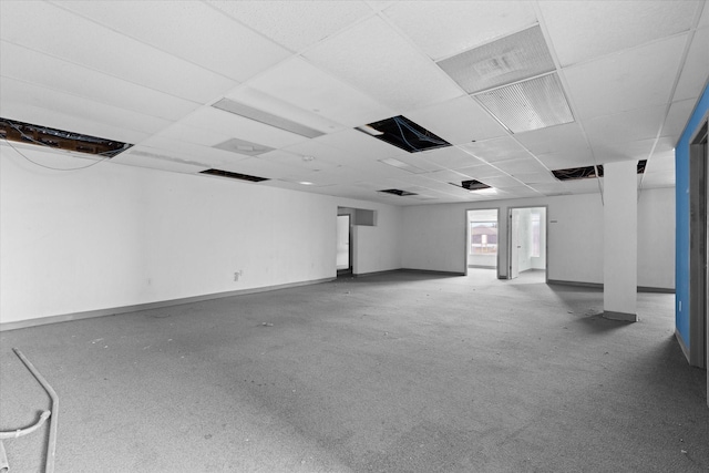 basement with a paneled ceiling