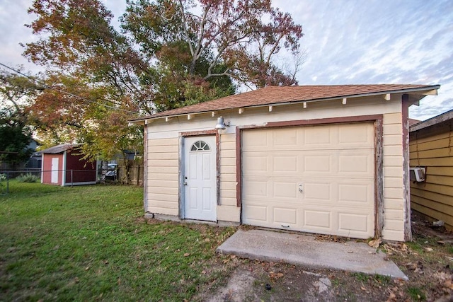 garage featuring a yard