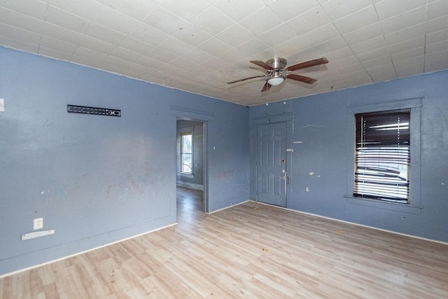 unfurnished room featuring ceiling fan and light hardwood / wood-style flooring