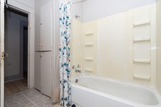 bathroom featuring tile patterned floors and shower / bath combo