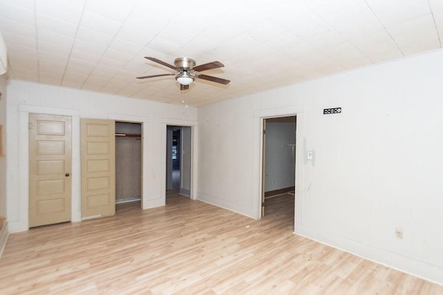 spare room featuring ceiling fan and light hardwood / wood-style flooring