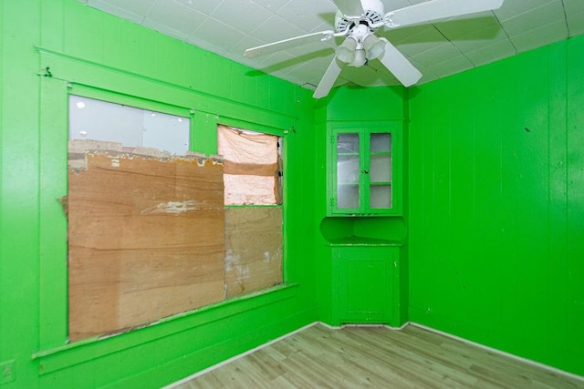 unfurnished room featuring ceiling fan and light wood-type flooring